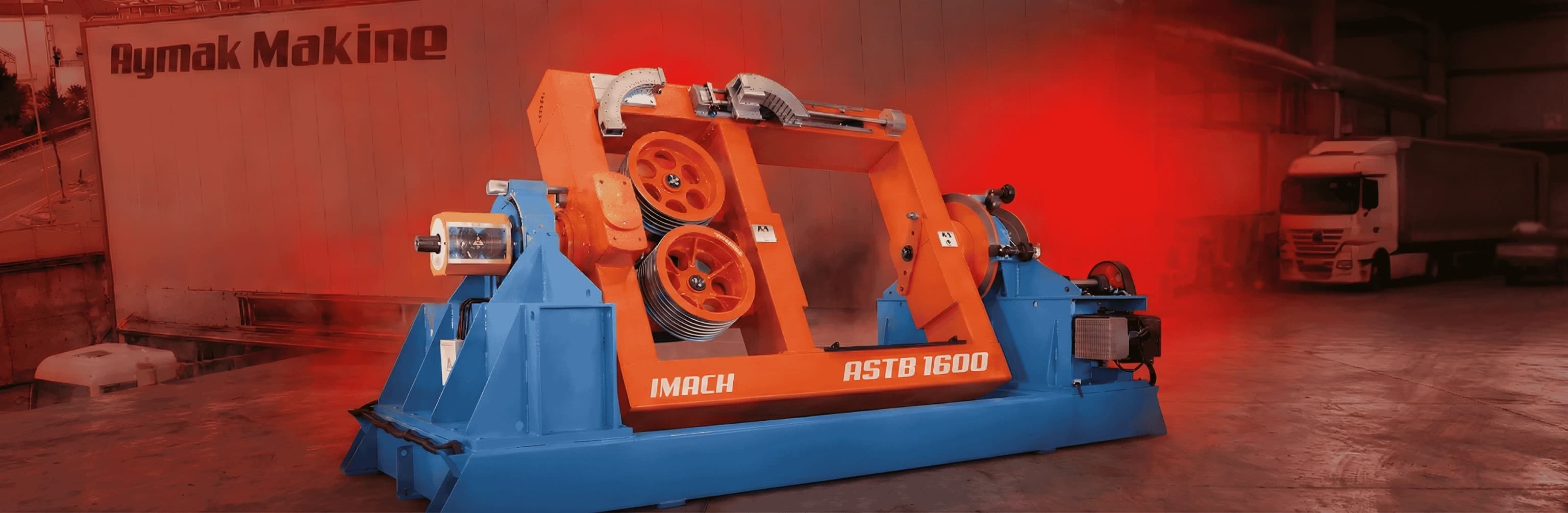 Aymak Makine industrial machine - IMACH branded red and white payoff/takeup system in operation