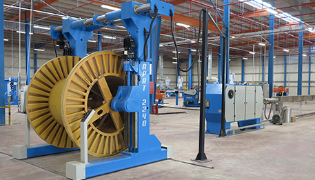 Cable manufacturing line with automated take-up system.